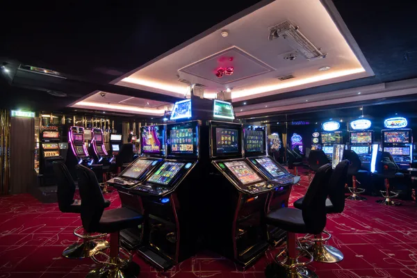 A person using their device against a moody casino-themed background, illustrating the smooth re-entry process at 588WIM.